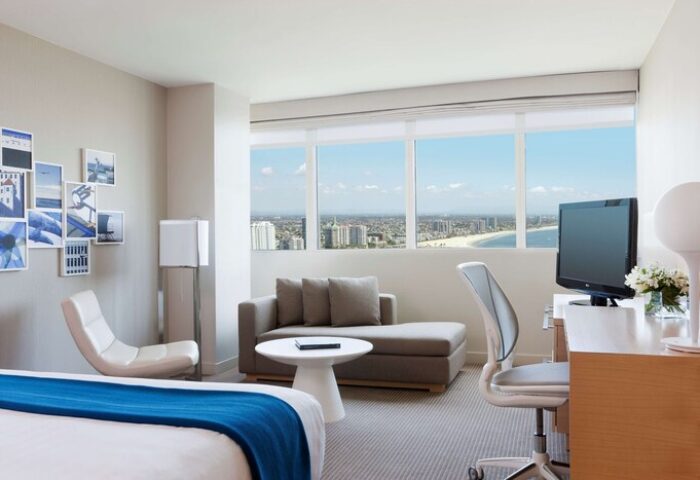 Hyatt Regency Long Beach hotel room. Modern interior with ocean view. Gay-friendly travel in Long Beach, California. Relaxing stay.