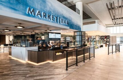 Hyatt Regency Long Beach's Market Bar. Modern interior design with a blue accent wall and a well-stocked bar. Gay-friendly hotel.