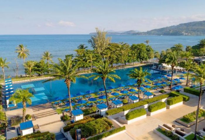 Hyatt Regency Phuket Resort aerial view. Gay-friendly hotel with pool, beach, palm trees, and ocean views. An ideal gay travel destination.