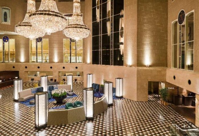 Hyatt Regency Tokyo lobby. Grand chandeliers, seating areas, and patterned floor. Gay-friendly hotel in Tokyo, Japan. Upscale travel.