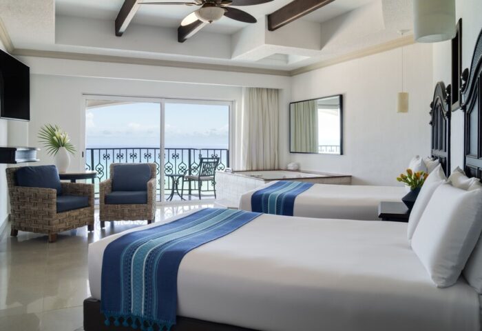 Hyatt Zilara Cancun gay-friendly hotel room with ocean view. Two beds, balcony, jacuzzi. Perfect for gay travel and a luxury vacation.