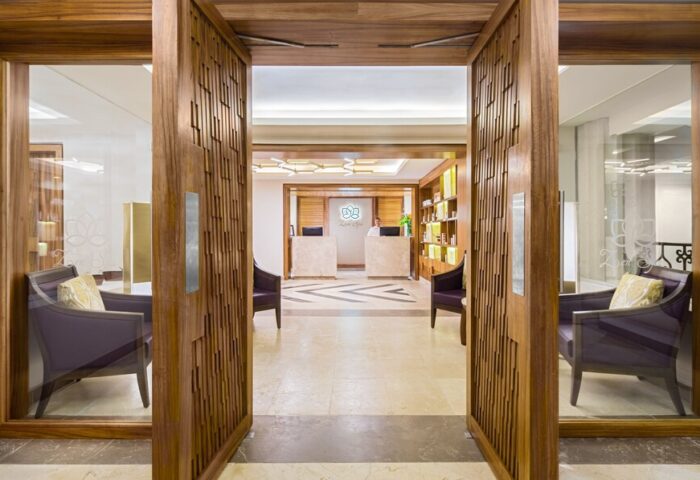 Hyatt Zilara Cancun spa entrance. Gay-friendly hotel with luxurious design. Reception area with chairs. Ideal for gay men's travel, vacations.