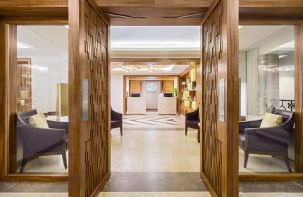 Hyatt Zilara Cancun spa entrance. Gay-friendly hotel with luxurious design. Reception area with chairs. Ideal for gay men's travel, vacations.