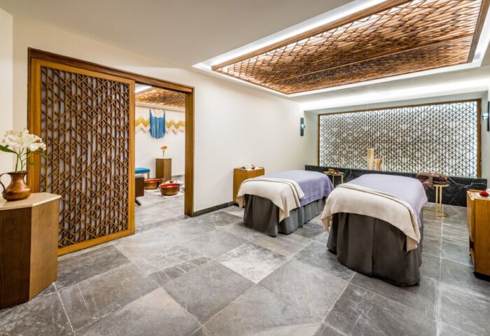 Hyatt Zilara Cancun's spa. Gay-friendly hotel featuring massage beds, patterned walls and wooden accents. A luxurious retreat for gay travelers.