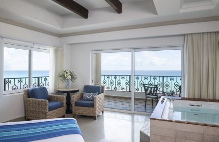 Hyatt Zilara Cancun gay-friendly hotel suite. Ocean view from balcony, jacuzzi tub, seating area. Ideal for gay travel in Cancun.