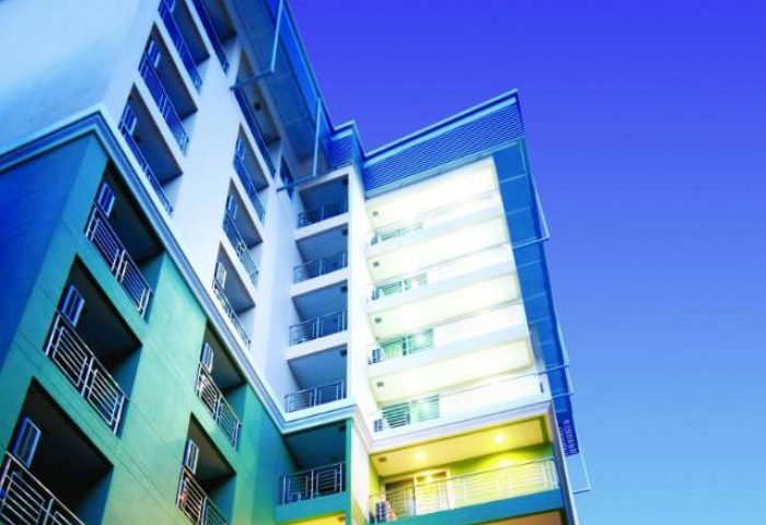 I Residence Hotel Sathorn exterior. Gay-friendly hotel in Bangkok with balconies. Modern architecture against a blue sky. Sathorn hotel.