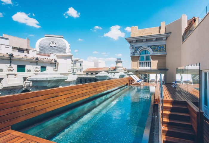 Iberostar Las Letras Gran Via rooftop pool. Gay-friendly, pet-friendly hotel in Madrid. Luxury travel for gay men. Gran Via views.