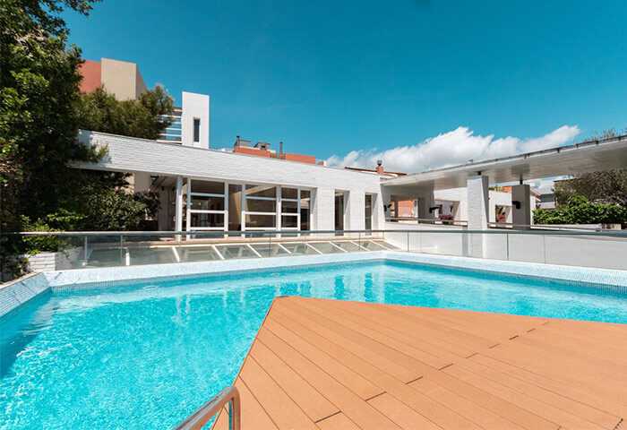 Ibersol Antemare Adults Only Hotel pool. Gay-friendly hotel with modern design, blue swimming pool, and wooden deck. Great for gay travel.