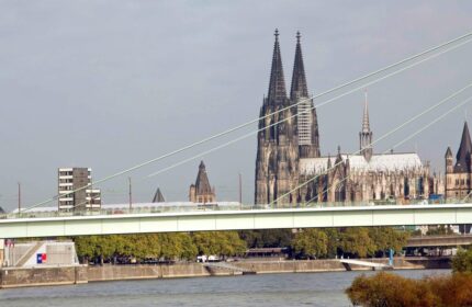Cologne Cathedral view from Ibis Hotel Koeln Centrum, a gay-friendly hotel. Bridge over the Rhine River in Köln, Germany. Gay travel.
