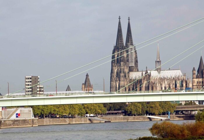 Cologne Cathedral view from Ibis Hotel Koeln Centrum, a gay-friendly hotel. Bridge over the Rhine River in Köln, Germany. Gay travel.