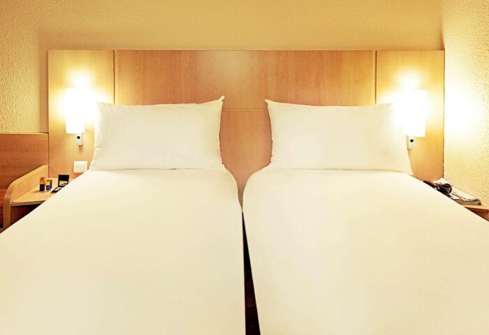 Ibis Milano Centro Hotel room with two beds. Gay-friendly hotel option in Milan, Italy. Clean, comfortable lodging for gay travelers.