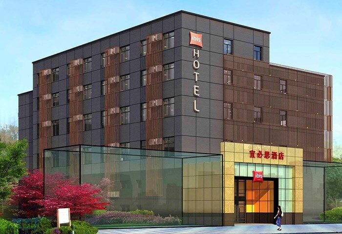Ibis Shanghai Xujiahui Hotel exterior. Modern building, gay-friendly hotel. Facade with Ibis logo. Good location for gay travelers in Shanghai.