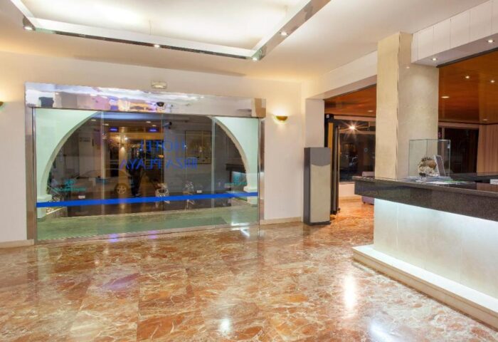 Ibiza Playa gay-friendly hotel entrance. Reception area with marble floors and glass doors. Welcoming space for gay travelers in Ibiza.