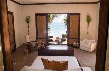 Imanta Resorts Punta De Mita gay-friendly hotel room with ocean view. Luxury travel for gay men in Mexico. Deck chairs on the patio.