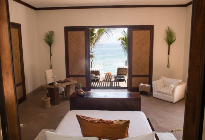 Imanta Resorts Punta De Mita gay-friendly hotel room with ocean view. Luxury travel for gay men in Mexico. Deck chairs on the patio.