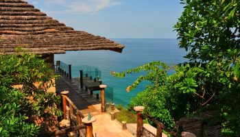 Imanta Resorts Punta De Mita gay-friendly hotel view. Ocean view from a thatched-roof villa. Tropical getaway for gay men's travel.