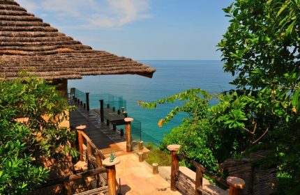 Imanta Resorts Punta De Mita gay-friendly hotel view. Ocean view from a thatched-roof villa. Tropical getaway for gay men's travel.
