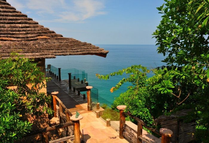 Imanta Resorts Punta De Mita gay-friendly hotel view. Ocean view from a thatched-roof villa. Tropical getaway for gay men's travel.