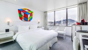 Imperial Palace Boutique Hotel room with Rubik's Cube art. Gay-friendly hotel offers stylish rooms, city views, and modern amenities for LGBTQ+ travelers.