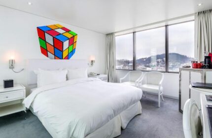 Imperial Palace Boutique Hotel room with Rubik's Cube art. Gay-friendly hotel offers stylish rooms, city views, and modern amenities for LGBTQ+ travelers.