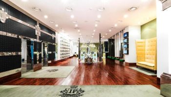 Luxurious lobby at Imperial Palace Boutique Hotel, a gay-friendly hotel. Polished wood floors, stylish decor, and a welcoming atmosphere.