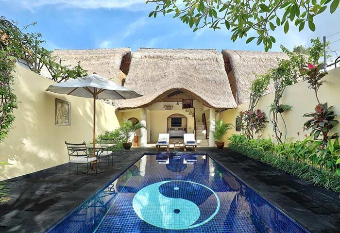 Impiana Private Villas Seminyak pool view. Gay-friendly hotel with Yin and Yang mosaic. Tropical villa, Seminyak, Bali. Luxury travel.