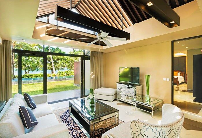 Impiana Resort Patong's gay-friendly hotel suite. Modern living room with garden view. A luxury stay for gay travelers in Patong, Thailand.