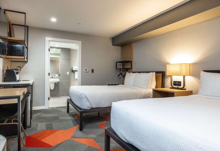 Infinity Hotel San Francisco, Tapestry Collection by Hilton guest room. Two beds, bathroom, desk, microwave. Gay-friendly hotel.