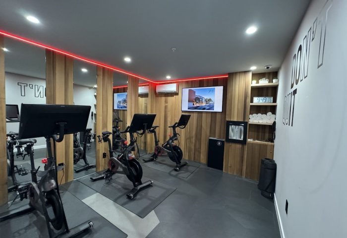 Infinity Hotel San Francisco gym. Tapestry Collection by Hilton, a gay-friendly hotel. Exercise bikes, towels, and motivation.