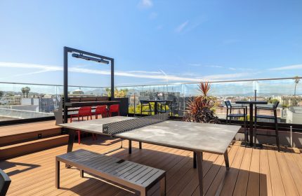 Infinity Hotel San Francisco rooftop with ping pong table. Gay-friendly hotel, Tapestry Collection by Hilton. Outdoor fun in the city.