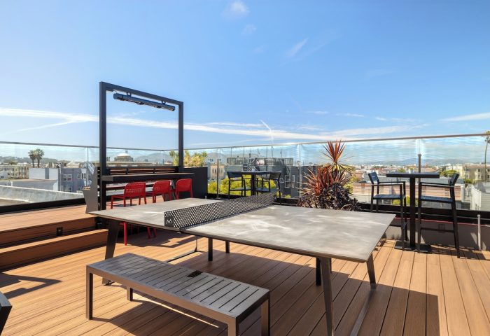 Infinity Hotel San Francisco rooftop with ping pong table. Gay-friendly hotel, Tapestry Collection by Hilton. Outdoor fun in the city.