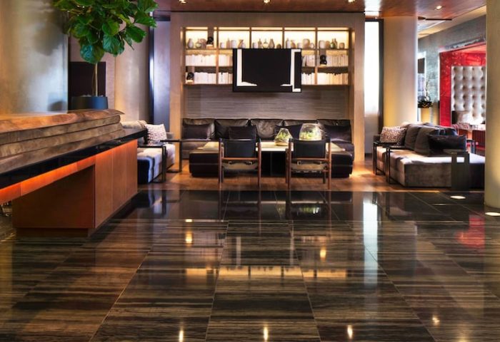 Ink 48 Hotel lobby interior. Gay-friendly hotel features stylish seating areas, modern design, and a welcoming atmosphere for LGBTQ+ travelers.