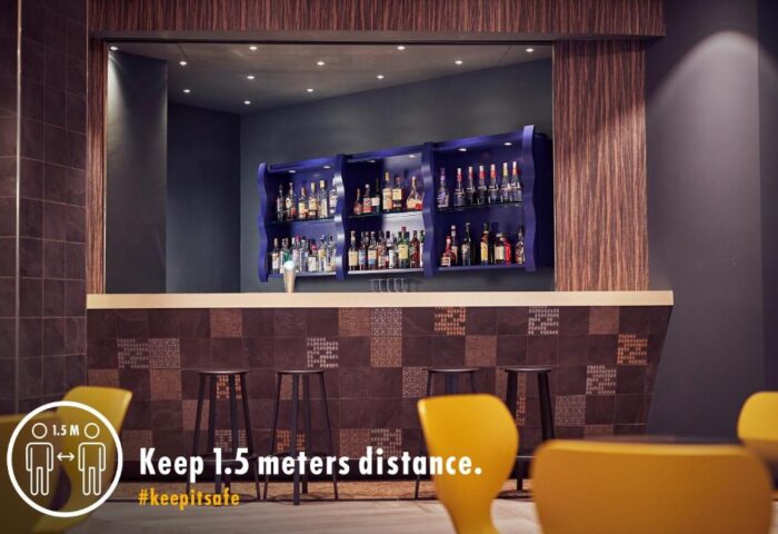 Bar area at Inntel Hotels Amsterdam Centre, a gay-friendly, pet-friendly hotel. Social distancing measures in place. #keepitsafe