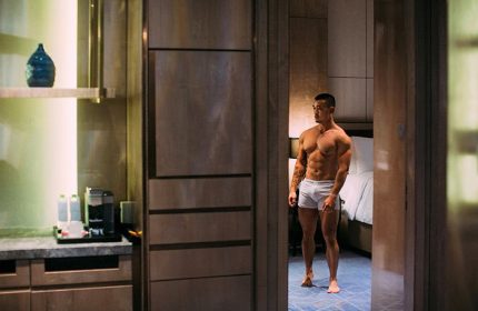 Gay-friendly InterContinental Hanoi Landmark72 hotel room. Muscular Asian man in underwear. Luxury travel for gay men. Hanoi hotels.