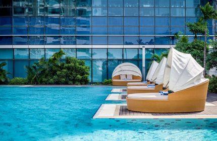 InterContinental Hanoi Landmark72 gay-friendly hotel pool. Relaxing sunbeds by the water. Perfect for gay travel in Hanoi, Vietnam.