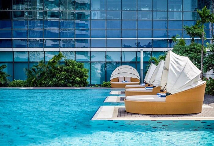 InterContinental Hanoi Landmark72 gay-friendly hotel pool. Relaxing sunbeds by the water. Perfect for gay travel in Hanoi, Vietnam.