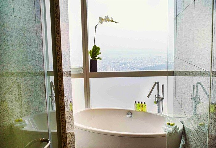 Bathtub view at InterContinental Hanoi Landmark72, a gay-friendly hotel. Relax in luxury with Hanoi skyline views. #GayTravel #Hanoi #LuxuryHotel