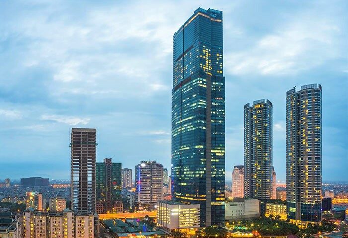 InterContinental Hanoi Landmark72, a gay-friendly hotel. Hanoi cityscape view at dusk. Modern architecture. Gay travel in Vietnam.