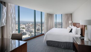 InterContinental San Francisco hotel room with city view. Gay-friendly hotel with modern design and floor-to-ceiling windows. Luxury travel for gay men.