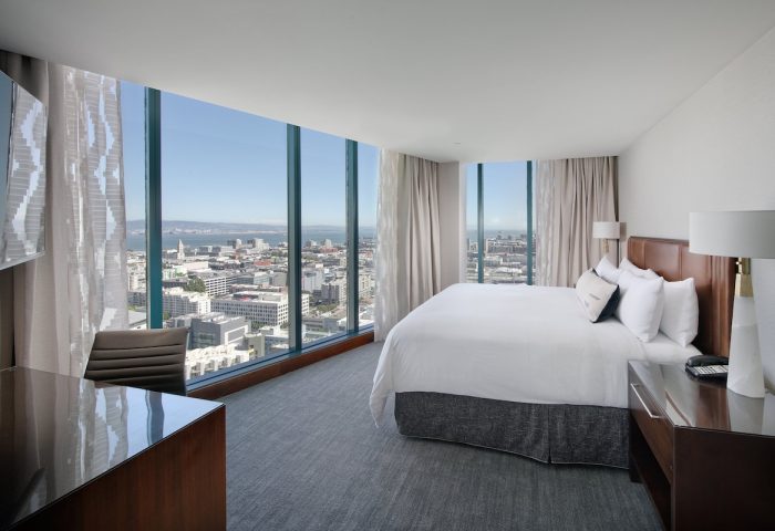 InterContinental San Francisco hotel room with city view. Gay-friendly hotel with modern design and floor-to-ceiling windows. Luxury travel for gay men.