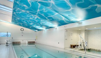 Indoor pool at the gay-friendly InterContinental San Francisco hotel. Ceiling with water effect, accessibility lift, and relaxing ambiance.