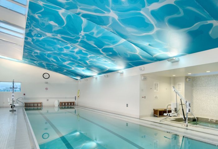 Indoor pool at the gay-friendly InterContinental San Francisco hotel. Ceiling with water effect, accessibility lift, and relaxing ambiance.