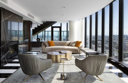 InterContinental San Francisco hotel suite. Modern living room with city view. Gay-friendly hotel interior design. Luxury travel.