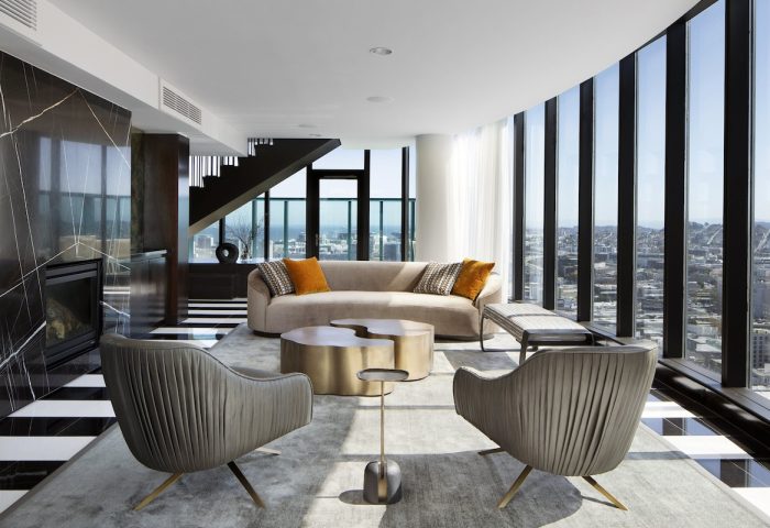 InterContinental San Francisco hotel suite. Modern living room with city view. Gay-friendly hotel interior design. Luxury travel.