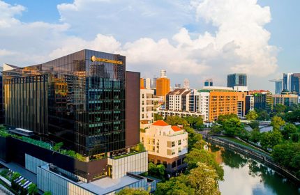 InterContinental Singapore Robertson Quay, a gay-friendly hotel. Exterior view of the hotel, river, and cityscape. Singapore travel.