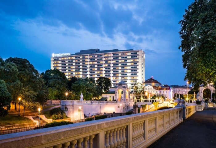 InterContinental Wien, a gay-friendly hotel. View of the hotel at dusk. A great choice for gay travelers visiting Vienna, Austria.