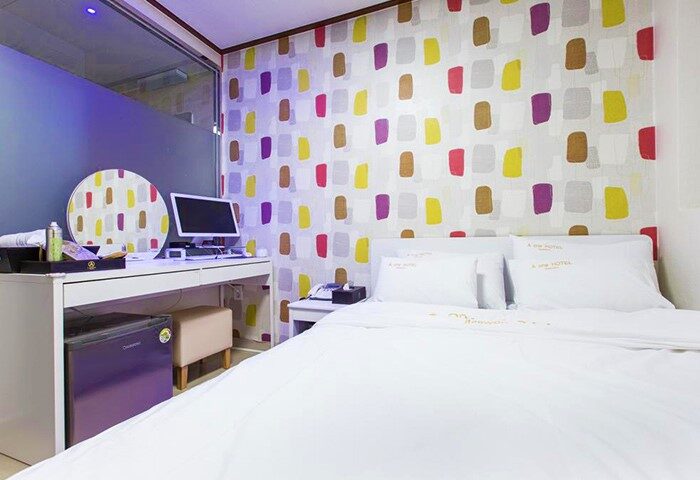 Itaewon A One Hotel room. Gay-friendly hotel in Seoul, South Korea. Room with double bed, desk, colorful wallpaper. Modern, clean, and comfortable.