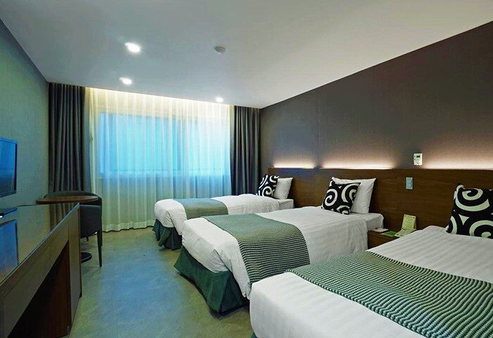 Itaewon Crown Hotel's room with three beds. Gay-friendly hotel in Seoul, South Korea. Comfortable stay for gay travelers.