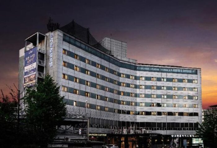 Itaewon Crown Hotel, a gay-friendly hotel in Seoul, South Korea. The hotel is a modern building with many windows. Great location for gay travelers.