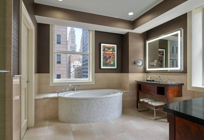 JW Marriott Chicago gay-friendly hotel bathroom with a large tub, vanity, and city view. Upscale design and amenities for gay travelers.